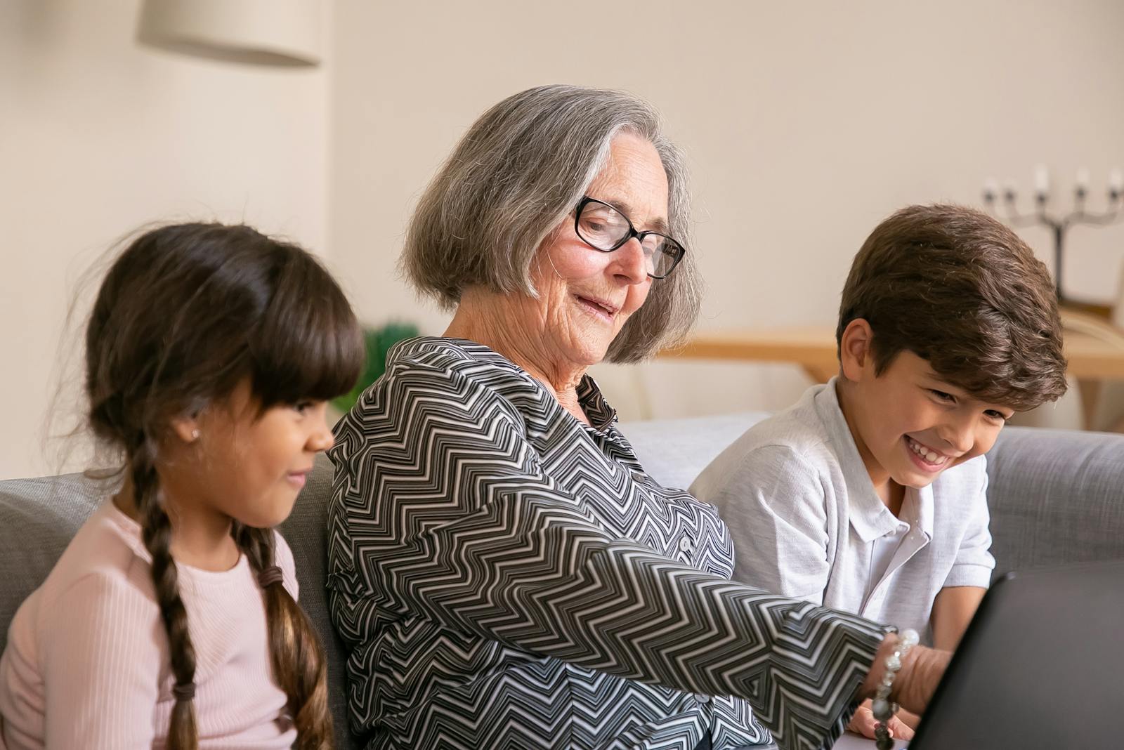 Grandparents with their children and grandchildren in a living room